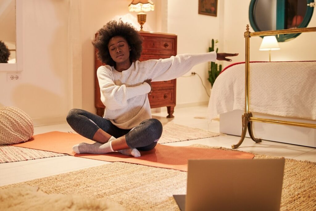 a young woman doing yoga before bed