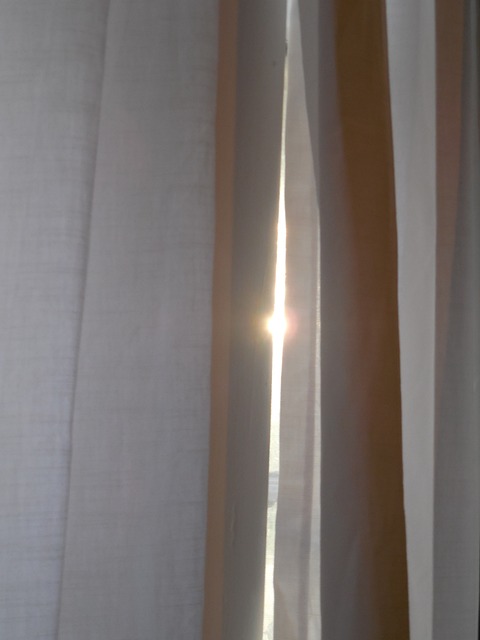 sun peeking through curtains