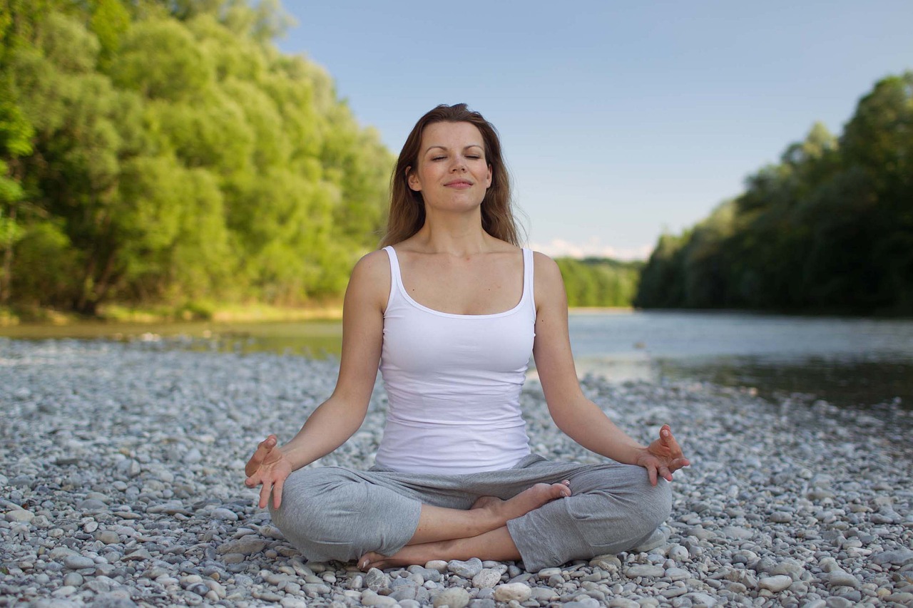 woman meditation river